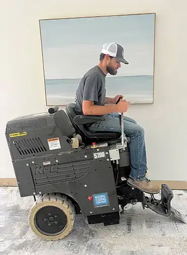 Florida Demo Masters technician using dust-free tile removal equipment with HEPA filtration in Gainesville FL